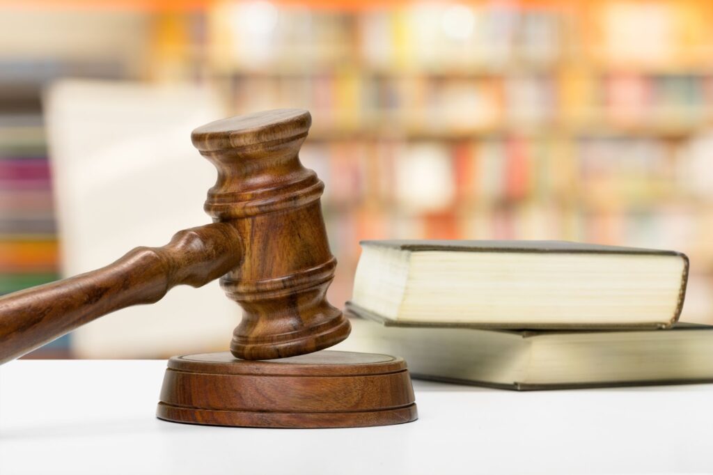 Close up of wooden gavel and books