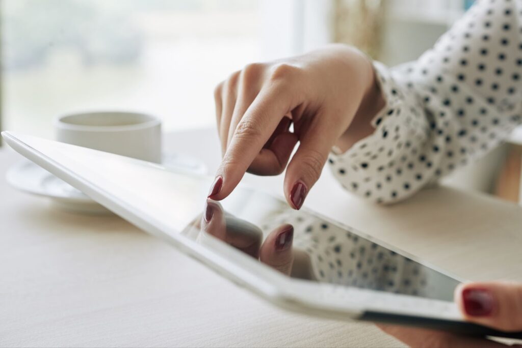 Close up of woman using a tablet