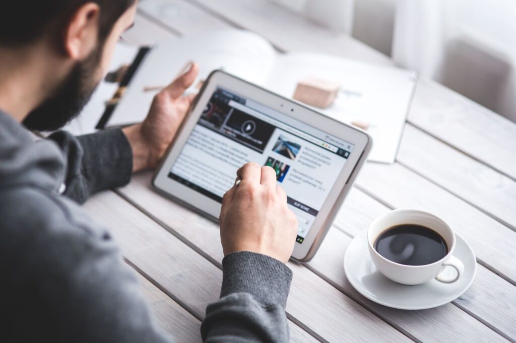 Man reading news with tablet