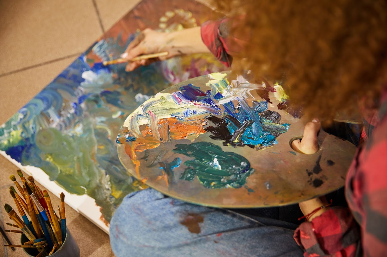 Close up of artist is drawing a painting